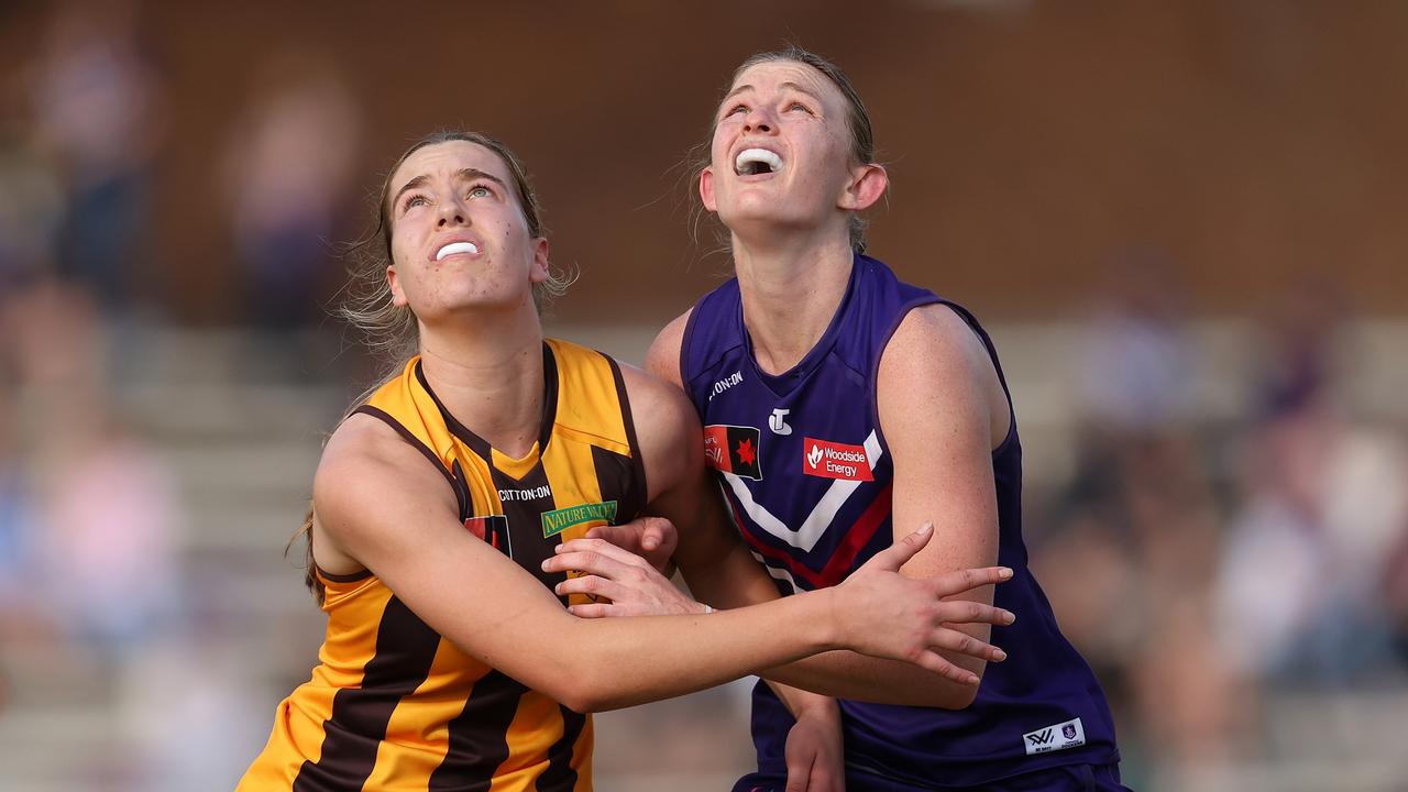 Dockers star Mim Strom (right) has credited a reunion with [PLAYERCARD]Beau McDonald[/PLAYERCARD] and his rubbish bin training drills for her improved ruck craft. Picture: Getty Images.