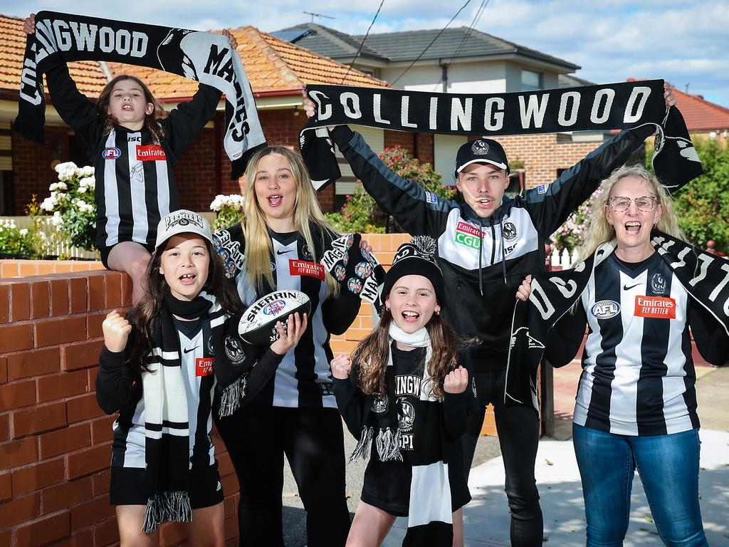 WEEKEND : AFL clubs and suburbs with members. Linda Monteneri with her son Matthew 19yrs and Lauren 25yrs and other supporters Lucinda 8yrs , Pia 10yrs and Milli 11yrs in the suburb of Reservoir. Picture: Ian Currie