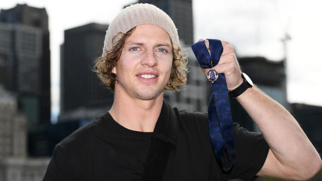 Fremantle’s Nat Fyfe shows off his second Brownlow Medal in Melbourne