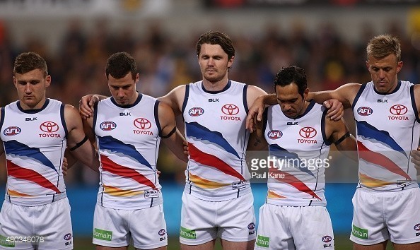 480346078-crows-players-line-up-for-a-moments-silence-gettyimages.jpg