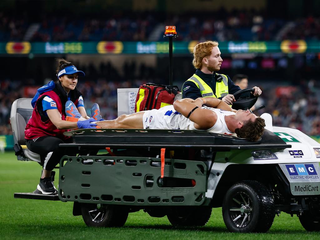 Charlie Comben is stretchered off during a game last year. Picture: Dylan Burns/AFL Photos via Getty Images