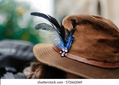 blue-feathers-brown-hat-260nw-572662069.jpg