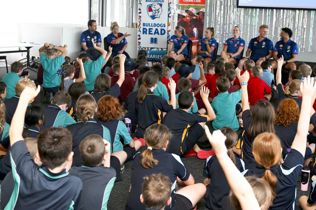 Western Bulldogs footballers Kristie-Lee Weston-Turner, Rylie Wilcox, Heidi Woodley and [PLAYERCARD]Jason Johannisen[/PLAYERCARD] talk books with more than 150 pupils on February 22, 2024. Picture by Lachlan Bence