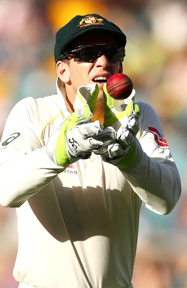 Paine catches a throw from the outfield during day one of the First Test at the Gabba. Picture: Getty