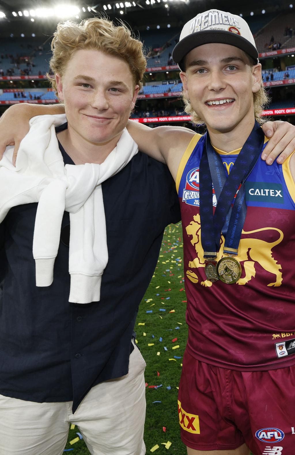 Levi and Willl Ashcroft on the MCG after Will won the Norm Smith Medal in a premiership-winning side. Picture: Michael Klein