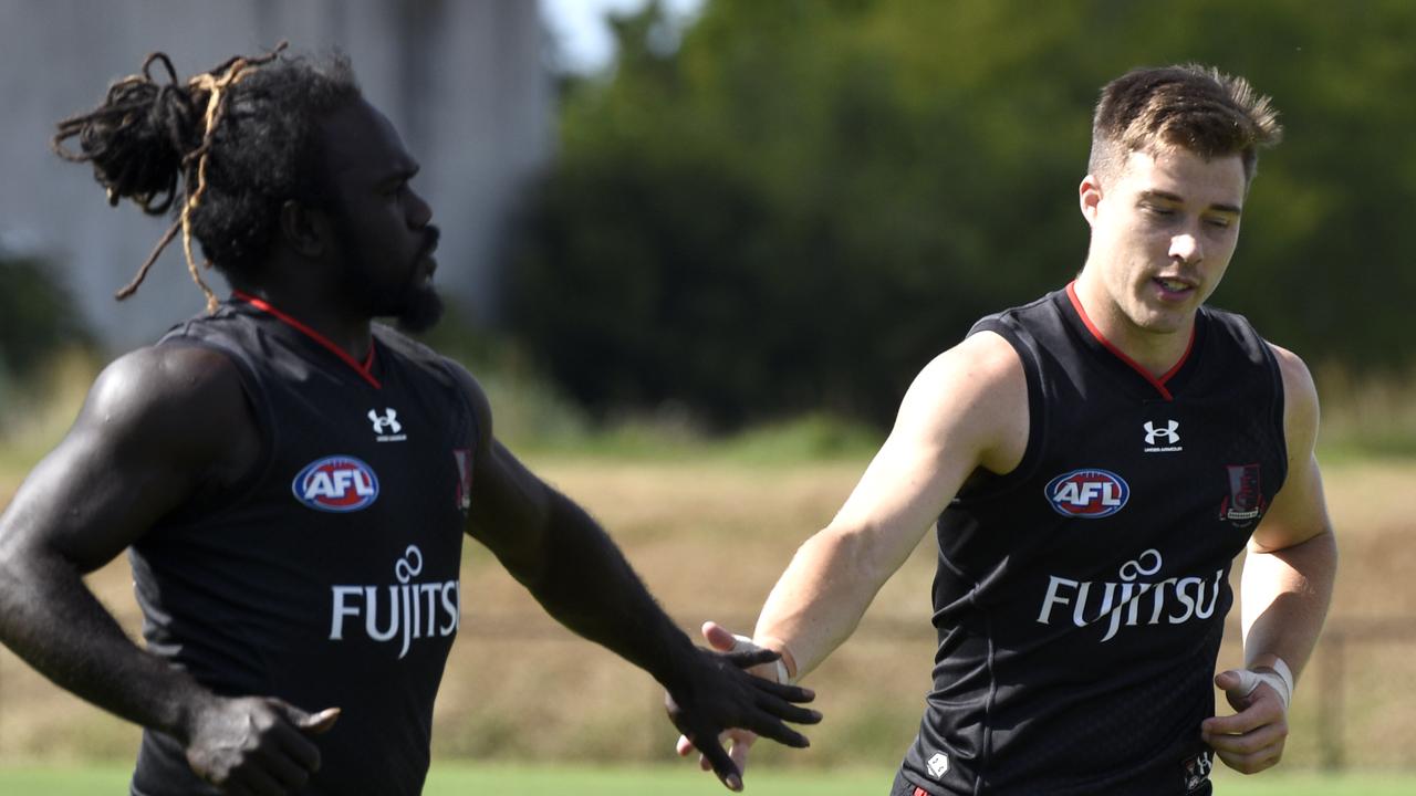 [PLAYERCARD]Anthony McDonald-Tipungwuti[/PLAYERCARD] and Zach Merrett at Essendon training at the Hanger, Tullamarine. Picture: Andrew Henshaw