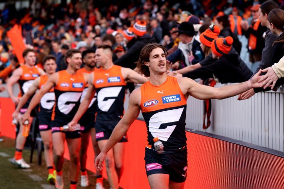 James Peatling celebrating with fans after the Giants’ win over Hawthorn in round 21.