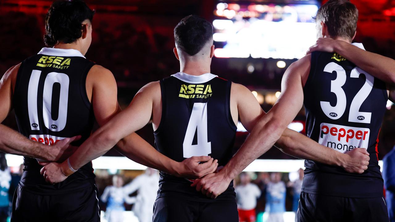 Mitch Owens, Jade Gresham and Mason Wood of the Saints are seen as part of Spud's Game ceremony. Picture: Michael Willson/AFL Photos via Getty Images