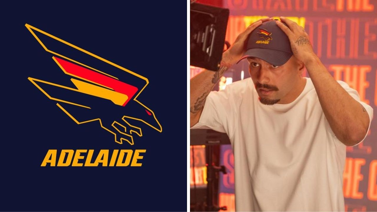 [PLAYERCARD]Izak Rankine[/PLAYERCARD] and the new Adelaide logo. Photos: AFC