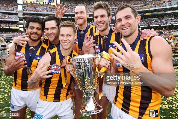 491123236-sam-mitchell-of-the-hawks-and-luke-hodge-gettyimages.jpg