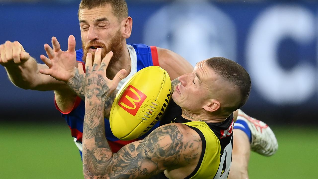 Dustin Martin marks in front of [PLAYERCARD]Liam Jones[/PLAYERCARD]. Picture: Quinn Rooney/Getty Images