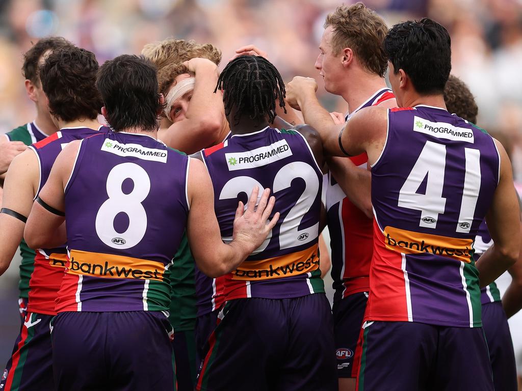 Fremantle teammates rush to congratulate Emmett on his first AFL goal. Picture: Paul Kane/Getty Images