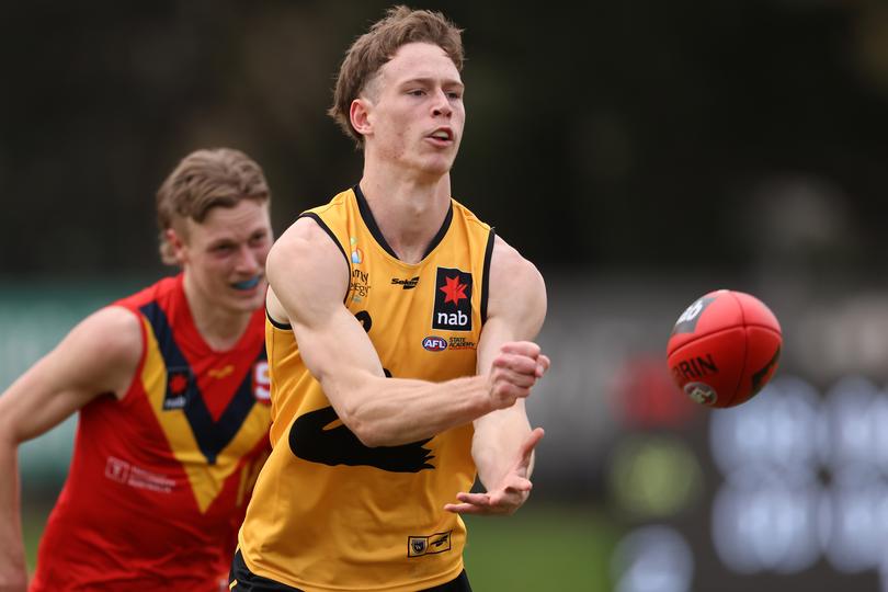 PERTH, AUSTRALIA - AUGUST 28: Matthew Johnson of Western Australia handballs during the NAB AFL U19 Championships game between Western Australia and South Australia at Mineral Resources Park on August 28, 2021 in Perth, Australia. (Photo by Paul Kane/Getty Images)