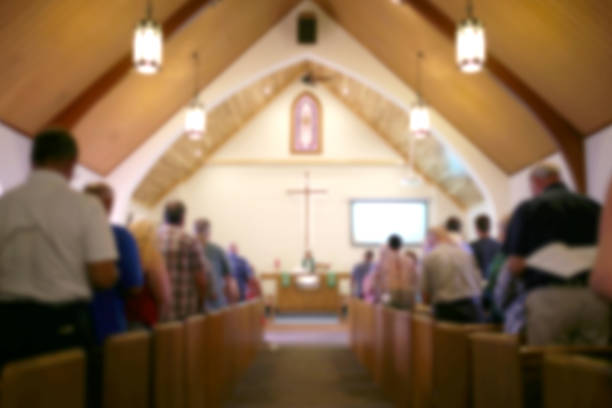 blurred-photo-of-the-iterior-of-a-church-sanctuary-with-congregation-picture-id1091404422