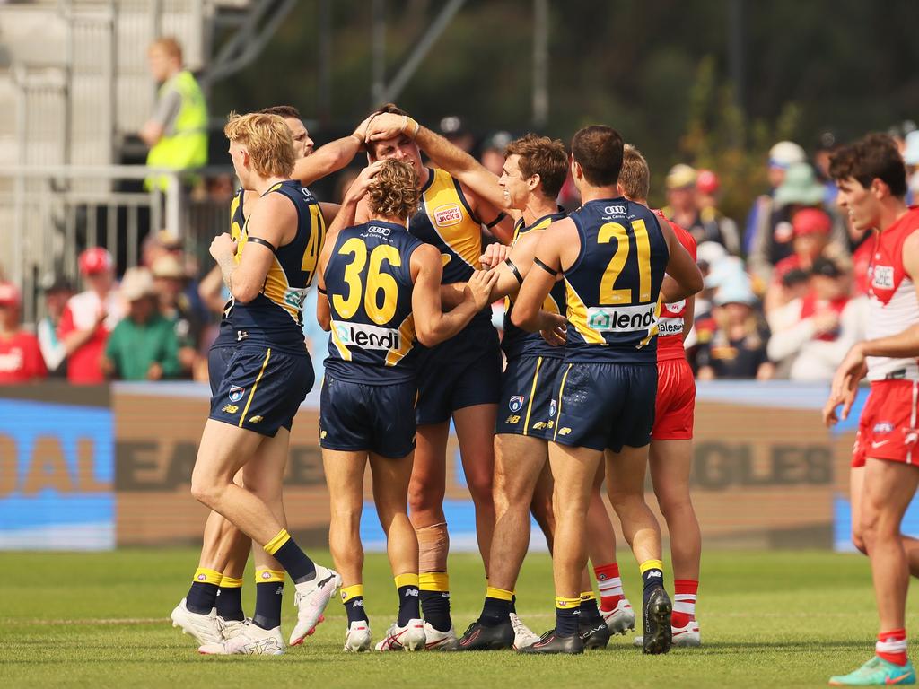 Teammates get around young Eagle Jack Williams at Mt Barker during Gather Round. Picture: James Elsby/Getty Images.