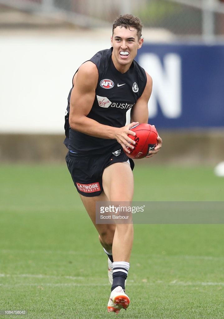 tom-williamson-of-the-blues-runs-with-the-ball-during-a-carlton-blues-picture-id1084758042