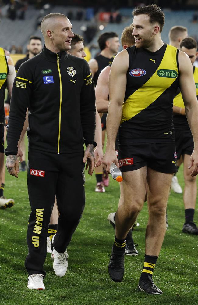 Dustin Martin walks off the MCG with [PLAYERCARD]Noah Balta[/PLAYERCARD] after being subbed out against Carlton. Picture: Michael Klein