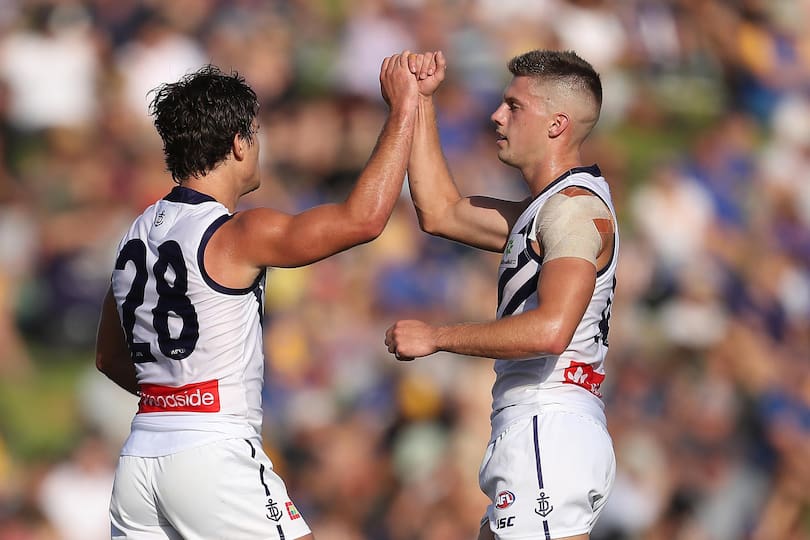 Lachie Schultz and Darcy Tucker celebrate.