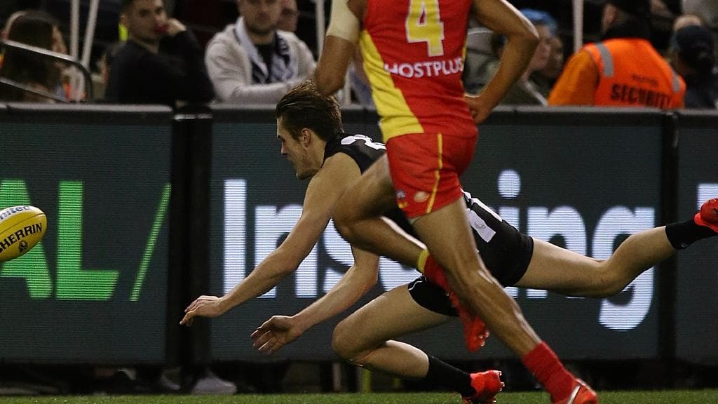 Darcy Moore strains his hamstring in a match against Gold Coast in 2016. Picture: Wayne Ludbey.