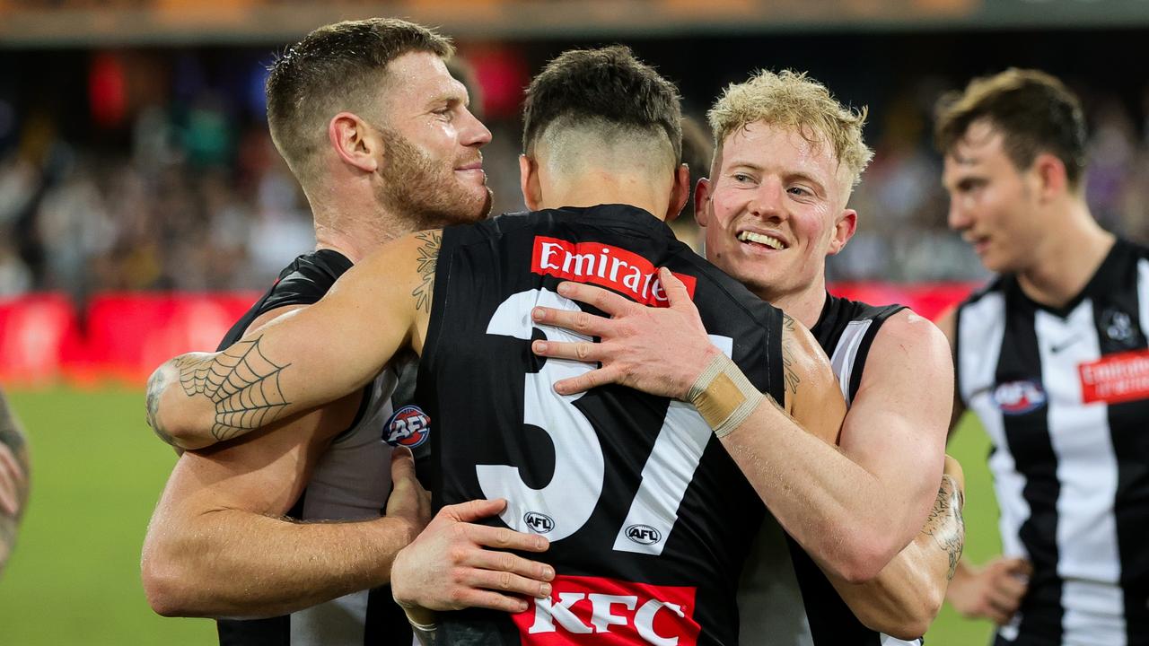 Adams, [PLAYERCARD]Oleg Markov[/PLAYERCARD] and [PLAYERCARD]John Noble[/PLAYERCARD] celebrate the win over Gold Coast. Picture: Russell Freeman/AFL Photos