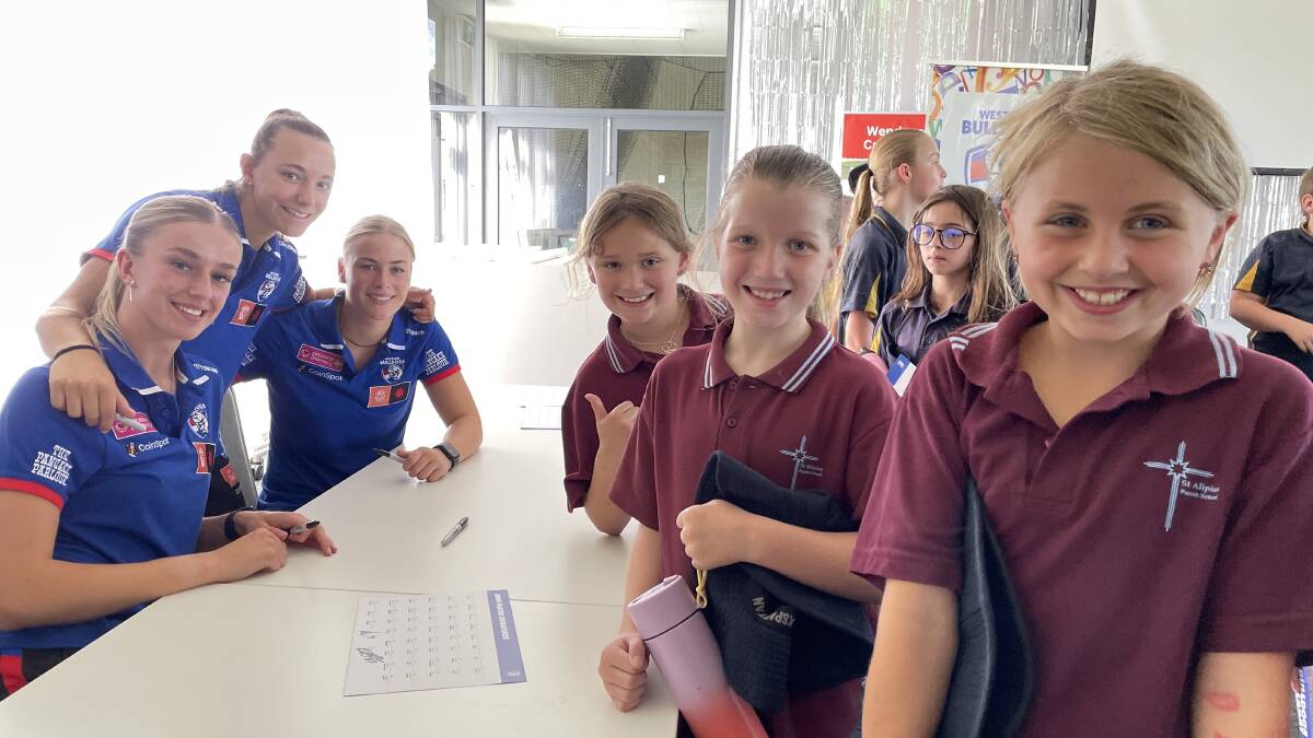 Western Bulldogs AFL players Kristie-Lee Weston-Tuner, Rylie Wilcox and Heidi Woodley meet St Alipius readers Goldie, Summer and Norah at the Bulldogs Read launch on February 22, 2024. Picture by Melanie Whelan