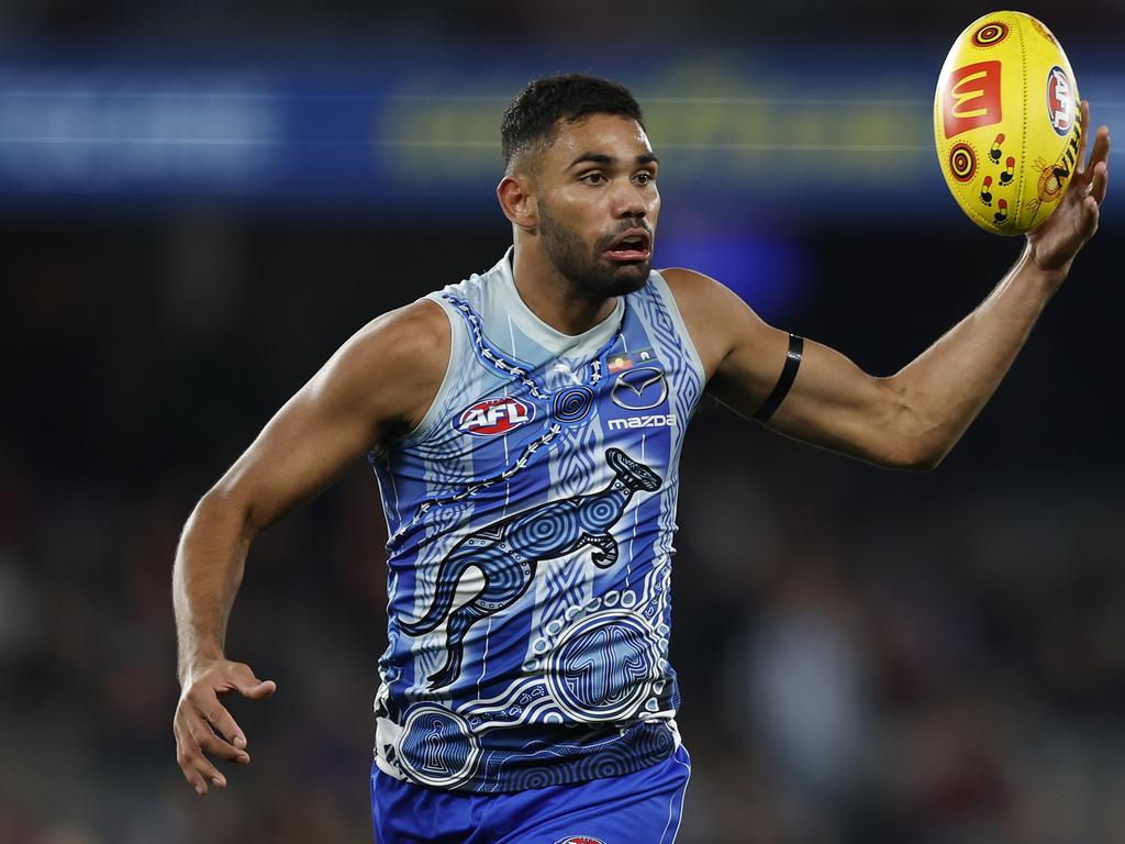 MELBOURNE, AUSTRALIA - MAY 21: Tarryn Thomas of the Kangaroos controls the ball during the round 10 AFL match between the North Melbourne Kangaroos and the Melbourne Demons at Marvel Stadium on May 21, 2022 in Melbourne, Australia. (Photo by Mike Owen/AFL Photos/via Getty Images)