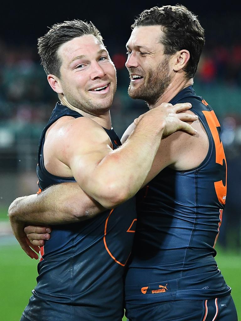 [PLAYERCARD]Toby Greene[/PLAYERCARD] and [PLAYERCARD]Sam Reid[/PLAYERCARD] celebrate the Giants Elimination Final triumph in 2021. Picture: Steve Bell/AFL Photos/via Getty Images