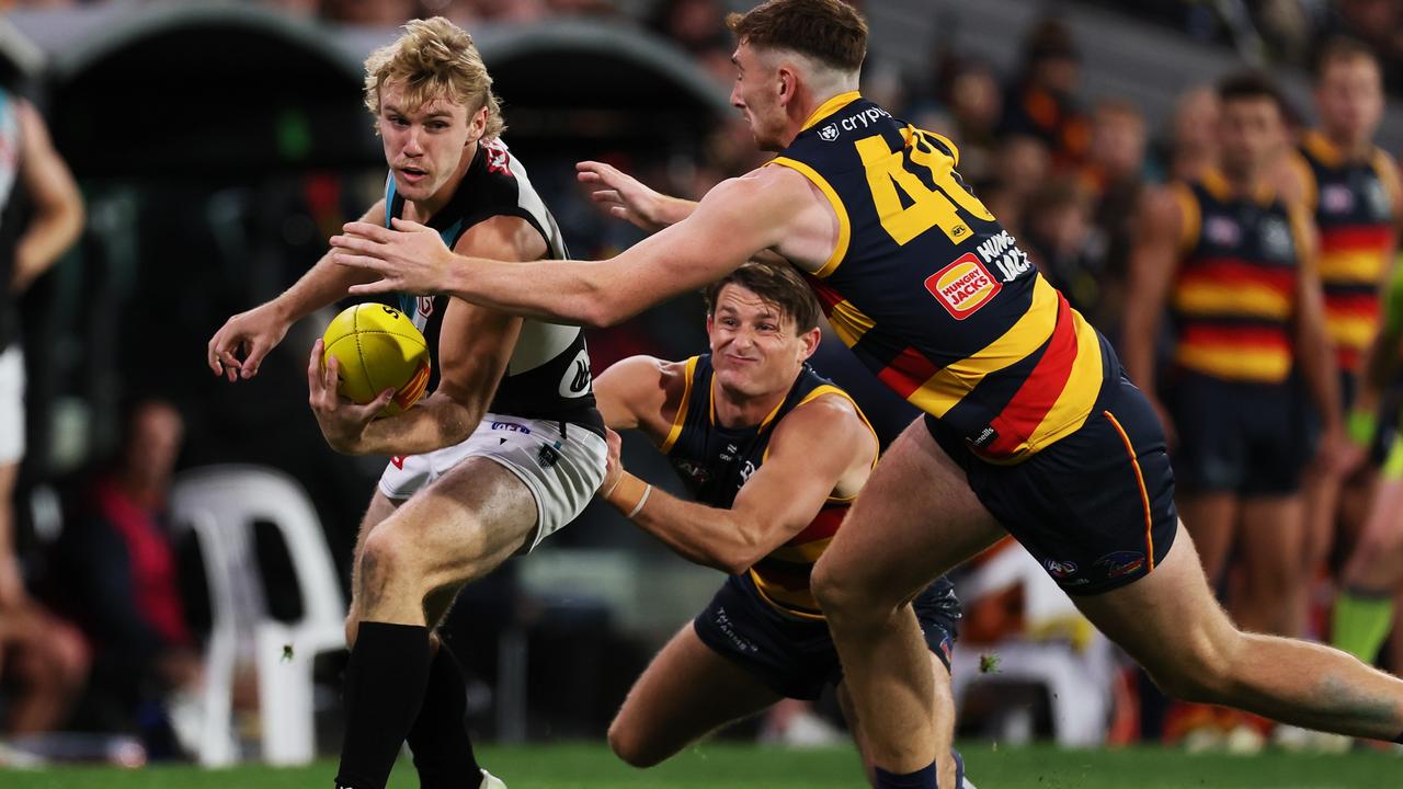 [PLAYERCARD]Matt Crouch[/PLAYERCARD] and Mark Keane hunt down Jason Horne-Francis during the Showdown on Thursday night. Picture: James Elsby/AFL Photos via Getty Images