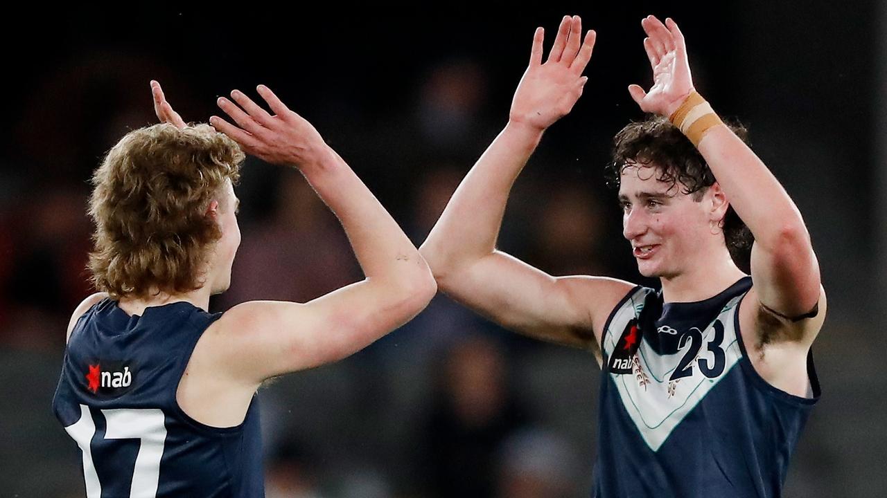 Elijah Tsatas, right, celebrates with Vic Metro teammate Bailey Macdonald. Picture: Dylan Burns/AFL Photos