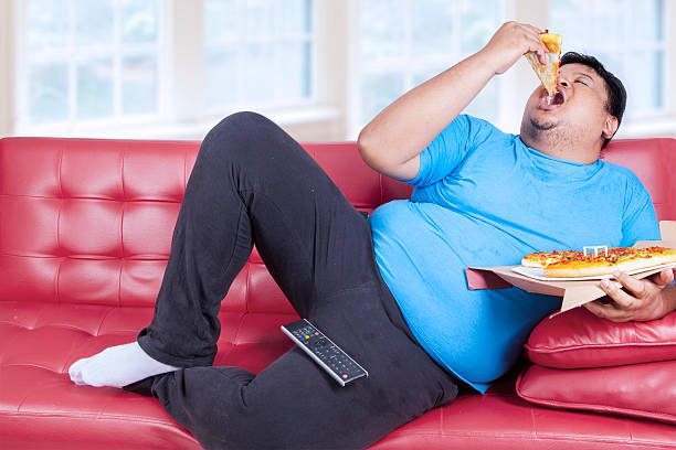 overweight-man-eats-pizza.jpg