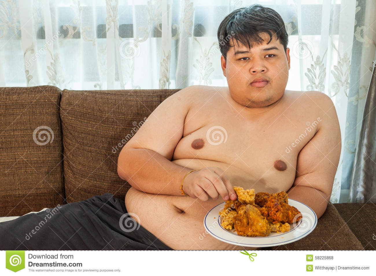 asian-fat-man-eating-fried-chicken-58225868.jpg