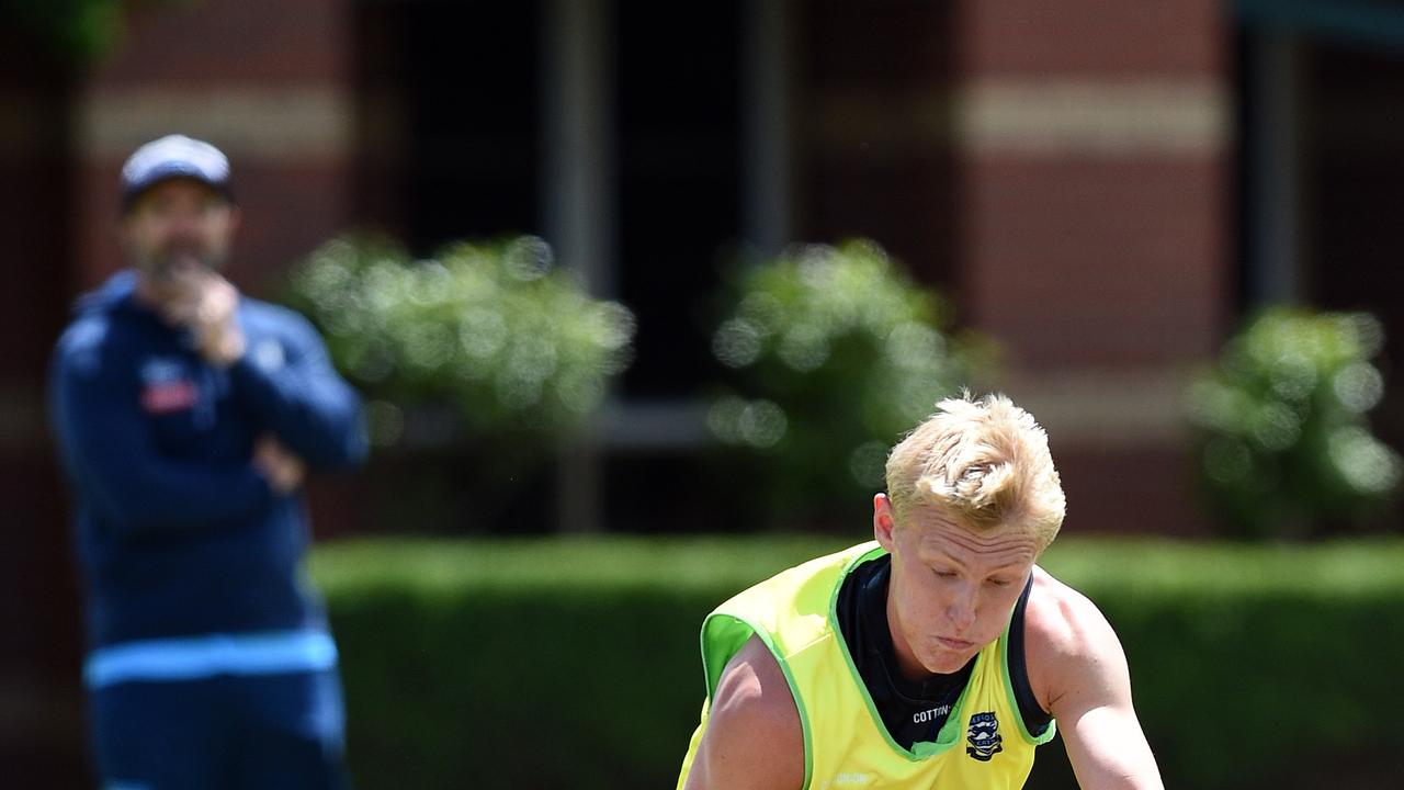 Ollie Dempsey and Mitch Knevitt clash at training.