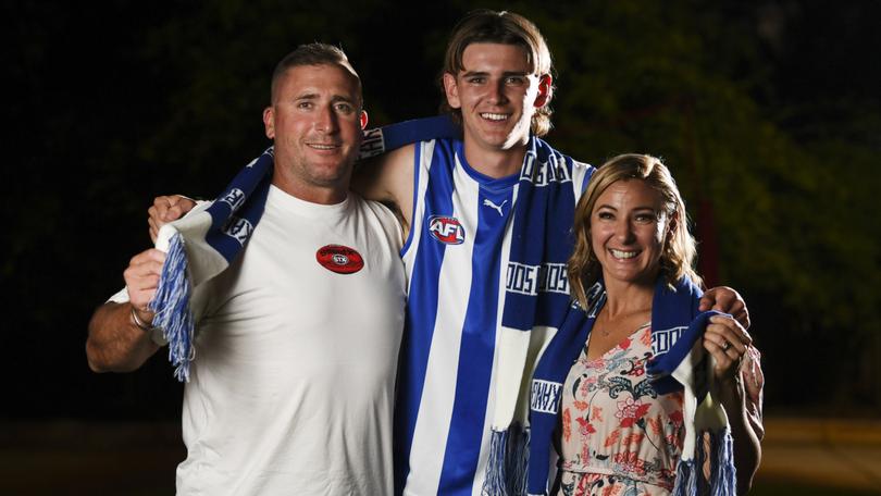 Riley Hardeman celebrates being picked by North Melbourne in the draft. Riley is pictured with parents Andy and Andrea.