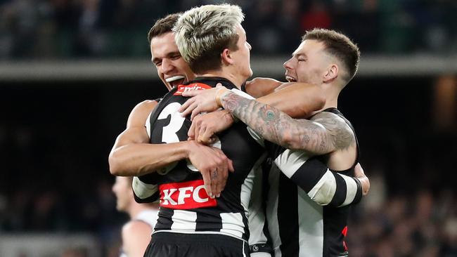 Ash Johnson, Jack Ginnivan and Jamie Elliott celebrate their semi-final success. Picture: Michael Willson/AFL Photos via Getty Images