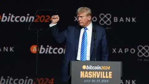 Reuters epublican presidential nominee and former U.S. President Donald Trump gestures at the Bitcoin 2024 event in Nashville, Tennessee, U.S., July 27, 2024. REUTERS/Kevin Wurm