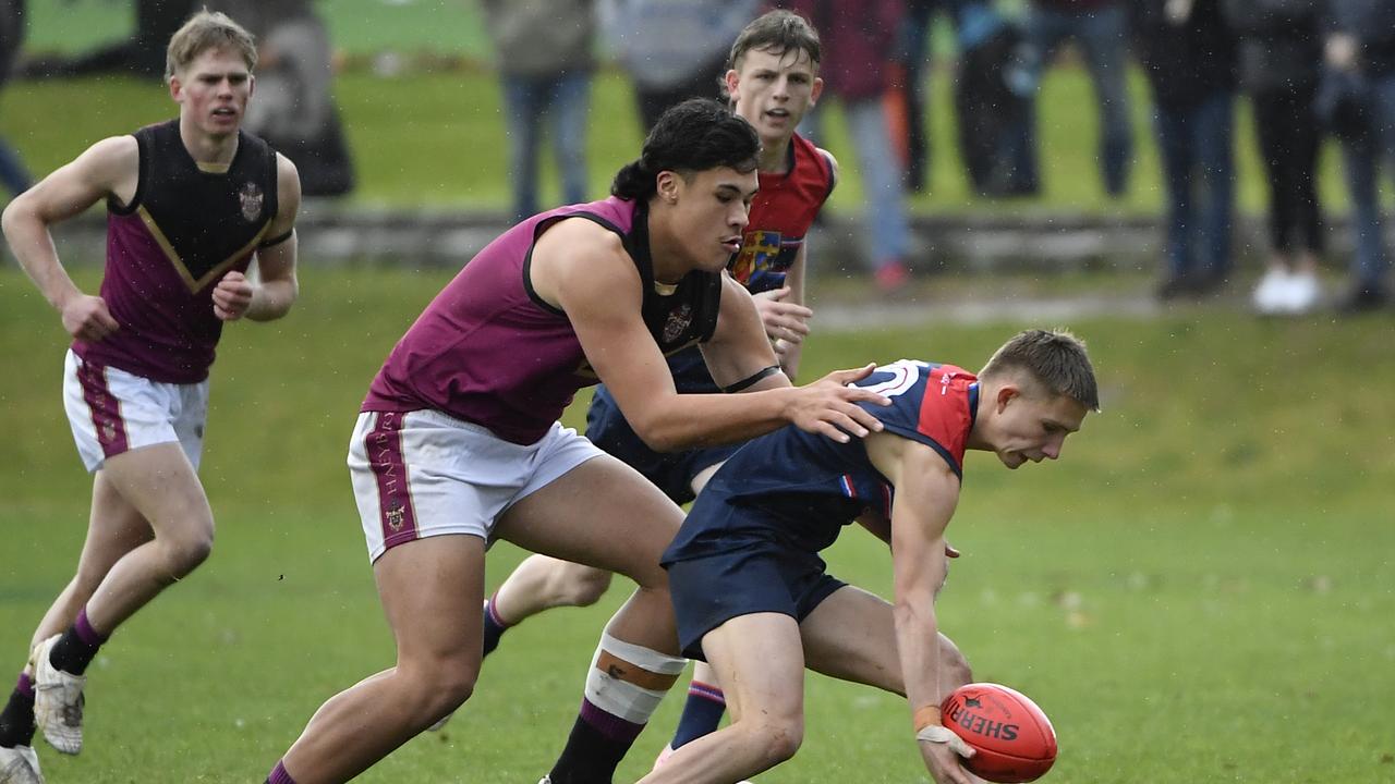 Tairon Ah-Mu (left) follows up at ground level. Picture: Andrew Batsch