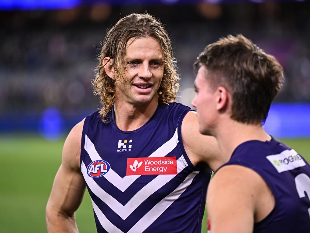 Nat Fyfe speaks to [PLAYERCARD]Caleb Serong[/PLAYERCARD] at Optus Stadium. Picture: Daniel Carson/AFL Photos via Getty Images.