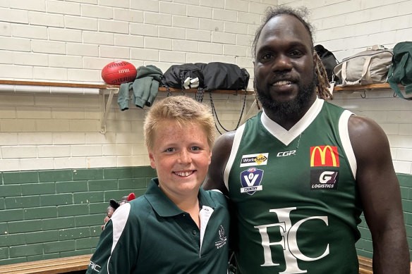 Charlie Dunn, 11, and former Essendon player [PLAYERCARD]Anthony McDonald-Tipungwuti[/PLAYERCARD].