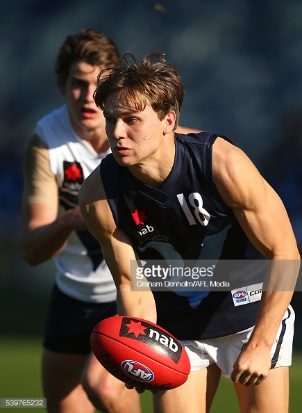 dylan-clarke-of-vic-metro-handballs-during-the-under-18s-afl-match-picture-id539765232