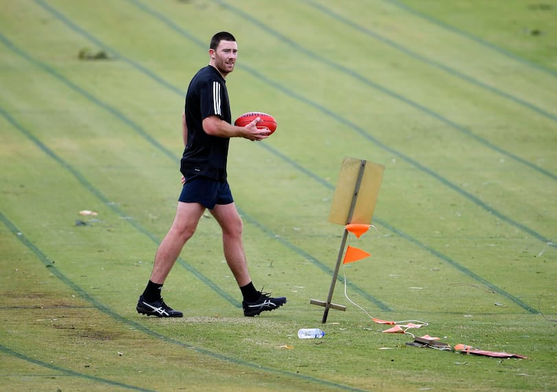 Jeremy McGovern trains at McGillivray Oval.