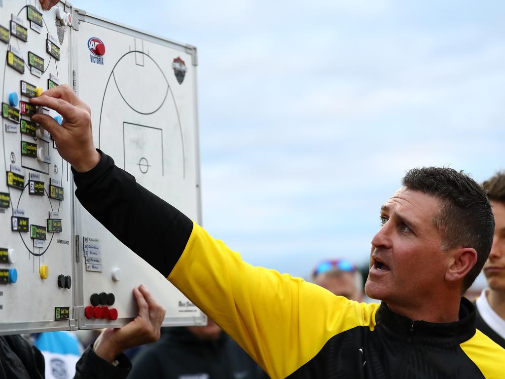 Stingrays coach Nick Cox works the whiteboard. Photo: Kelly Defina/AFL Photos/Getty Images