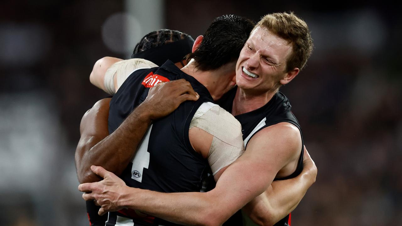 (L-R) [PLAYERCARD]Isaac Quaynor[/PLAYERCARD], [PLAYERCARD]Brayden Maynard[/PLAYERCARD] and [PLAYERCARD]Will Hoskin-Elliott[/PLAYERCARD] of the Magpies celebrate. Picture: Michael Willson/AFL Photos via Getty Images