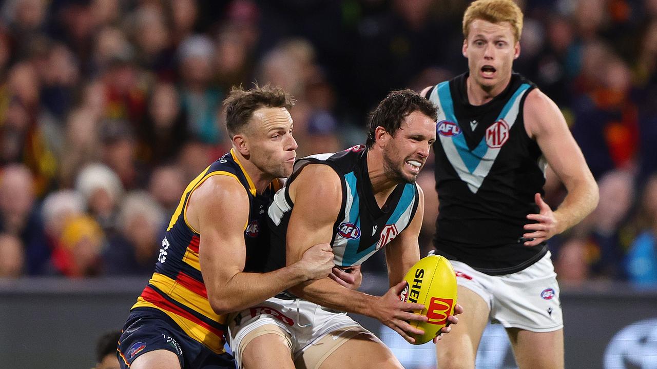 [PLAYERCARD]Brodie Smith[/PLAYERCARD] brings the heat on [PLAYERCARD]Travis Boak[/PLAYERCARD]. Picture: Sarah Reed/AFL Photos via Getty Images