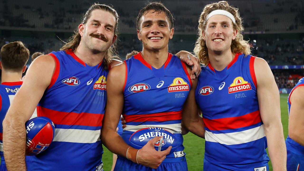 [PLAYERCARD]Josh Bruce[/PLAYERCARD] and [PLAYERCARD]Aaron Naughton[/PLAYERCARD] with man of the moment Jamarra Ugle-Hagan. Picture: Michael Willson/AFL Photos via Getty Images