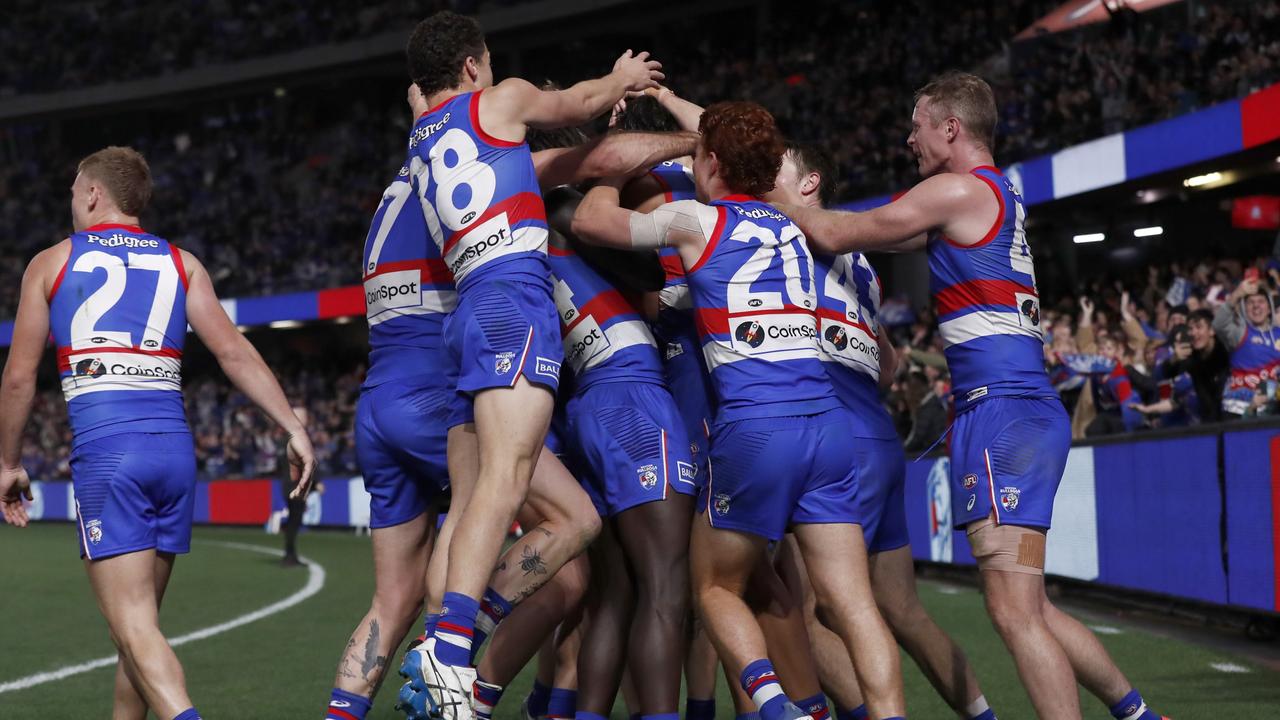 Ugle-Hagan is swamped by his teammates after kicking the sealer. Picture: Darrian Traynor/Getty Images