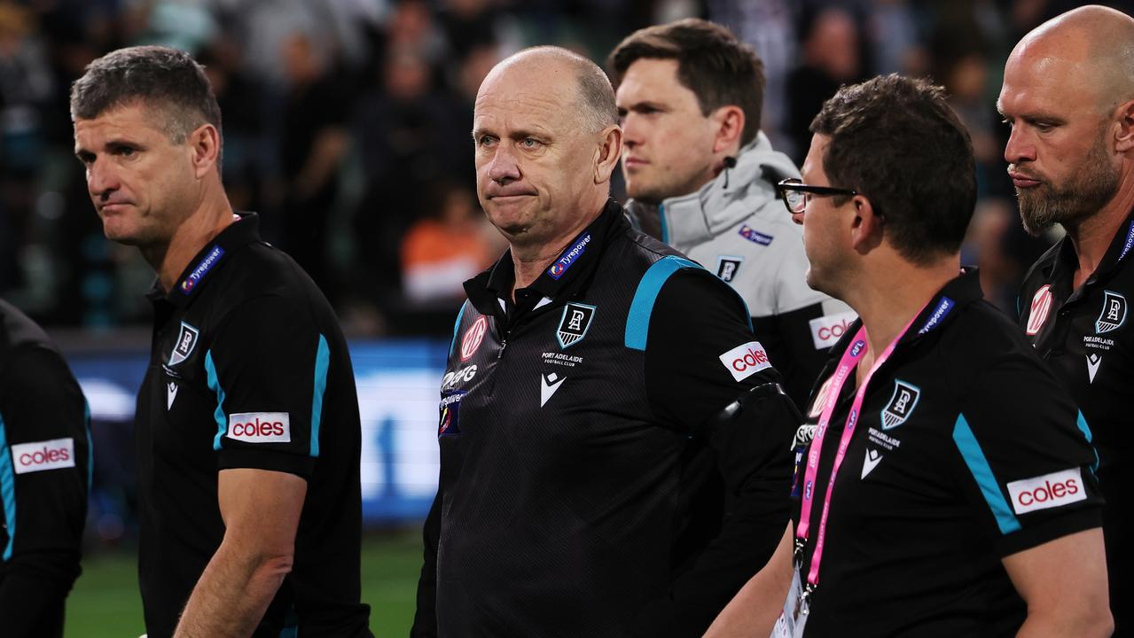 Hinkley and his coaches leave the field after the loss to the Giants. (Photo by James Elsby/AFL Photos via Getty Images)