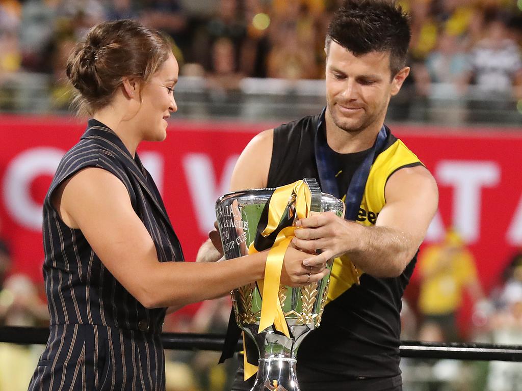 Ash Barty presented the premiership cup to [PLAYERCARD]Trent Cotchin[/PLAYERCARD] in 2020. Picture: Michael Klein