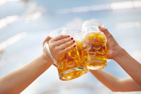 64496836-raised-beer-steins-at-oktoberfest-toasting.jpg