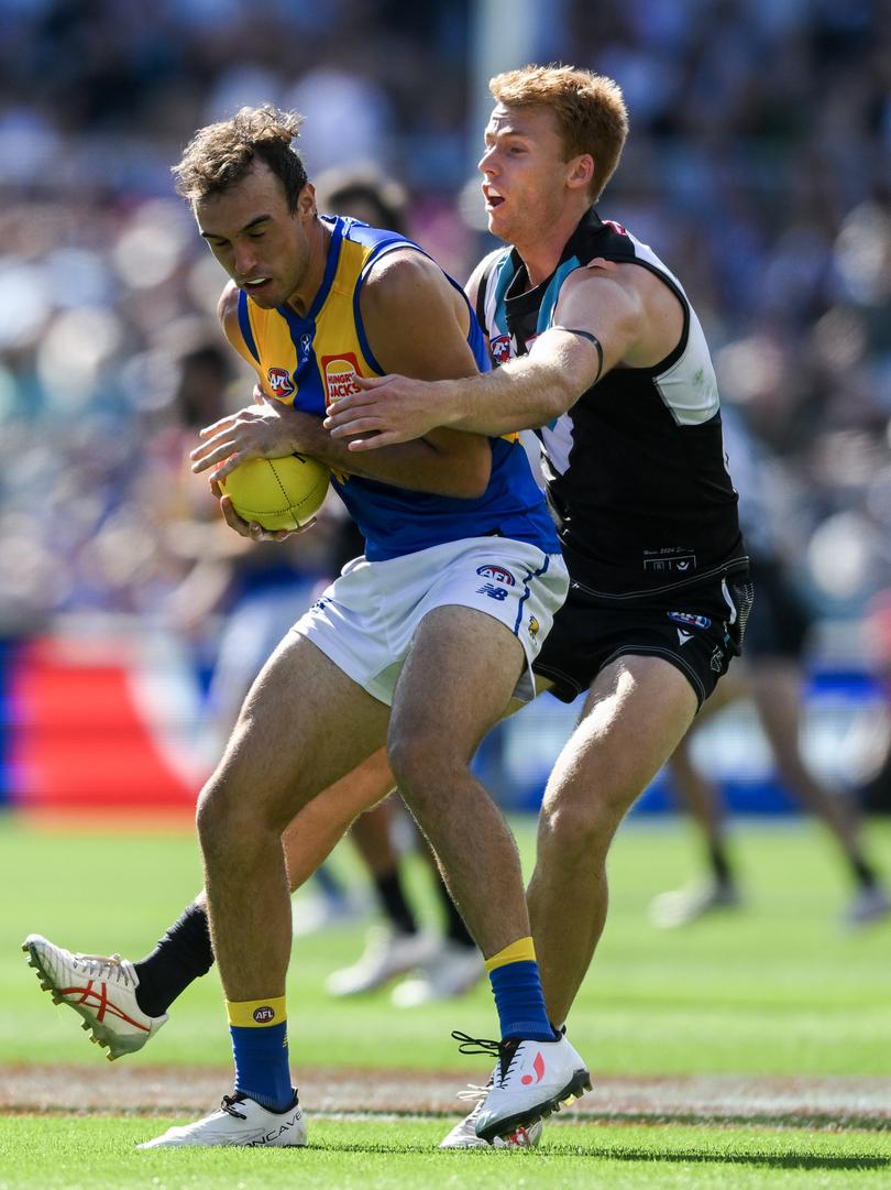 ADELAIDE, AUSTRALIA - MARCH 17:   Luke Edwards of the Eagles  marks  in front of  [PLAYERCARD]Willem Drew[/PLAYERCARD] of the Power during the round one AFL match between Port Adelaide Power and West Coast Eagles at Adelaide Oval, on March 17, 2024, in Adelaide, Australia. (Photo by Mark Brake/Getty Images via AFL Photos)