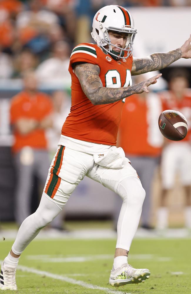 Lou Hedley punts for the University of Miami Hurricanes. Picture: Michael Reaves/Getty Images